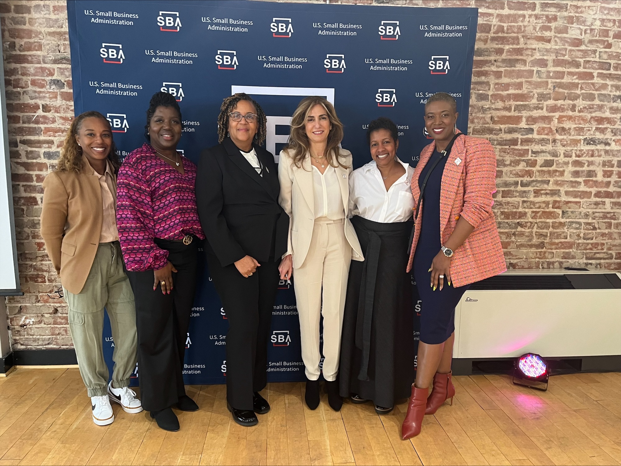 Council Members Brandy Butler, Shakenna Williams, Roberta McCullough and Samantha Abrams pose with NWBC Chair Sima Ladjevardian and Executive Director Tene Dolphin at the 2024 Women's Business Summit.